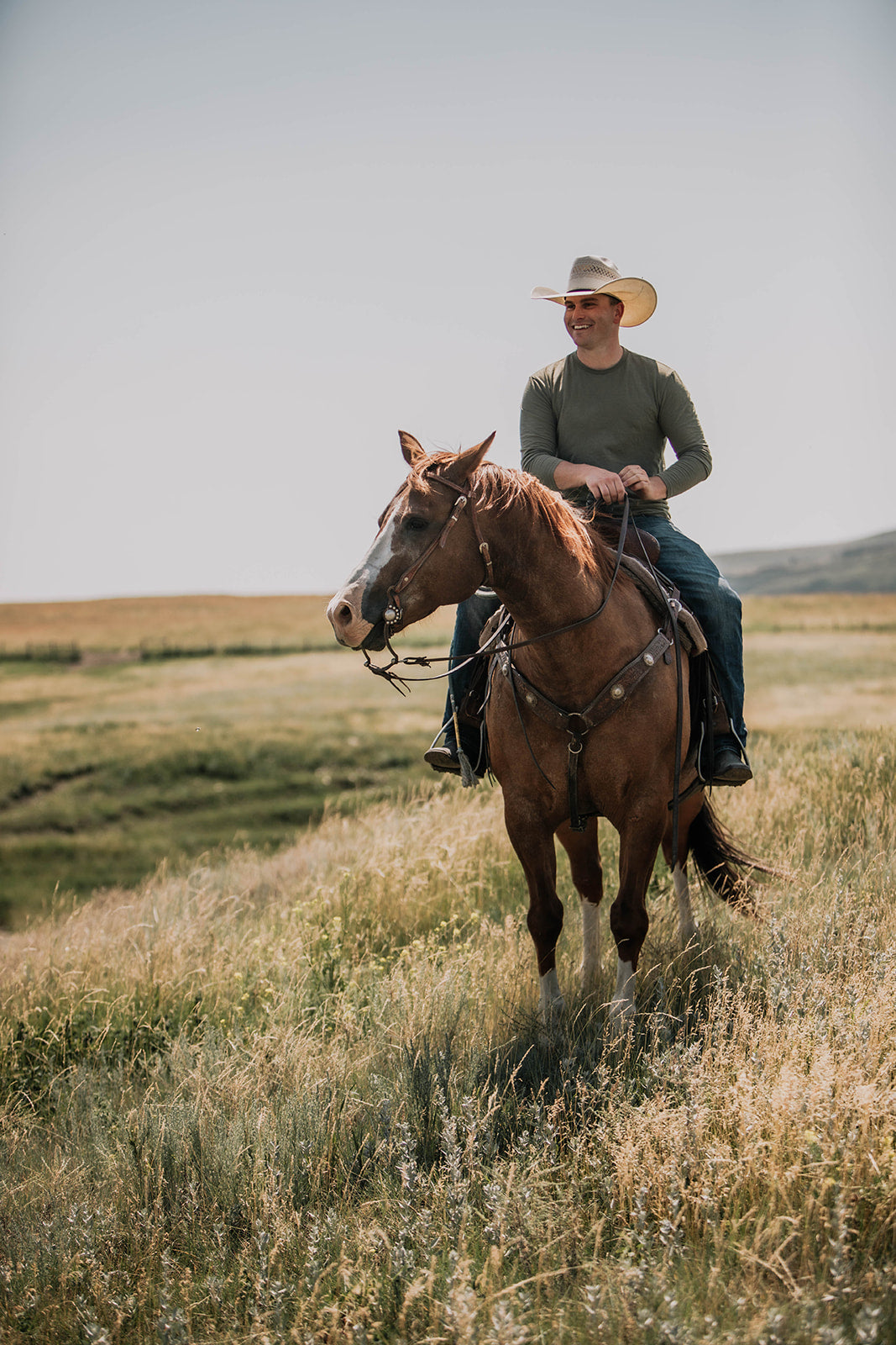 Michael Holmes riding on the ranch